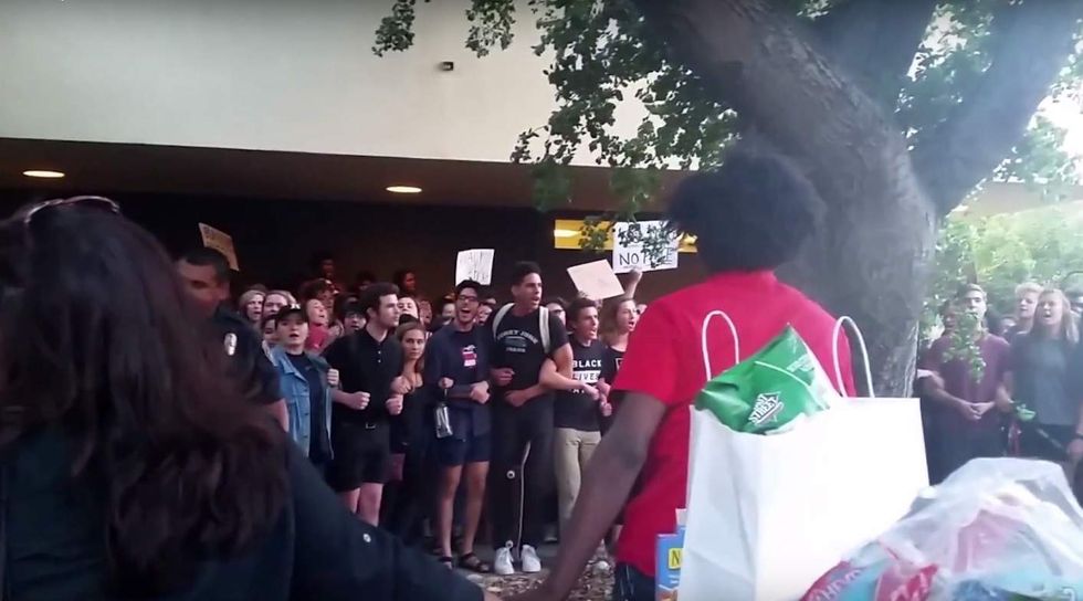 Black Lives Matter!': Mob descends upon campus building, pounds windows, shuts down pro-cop speech