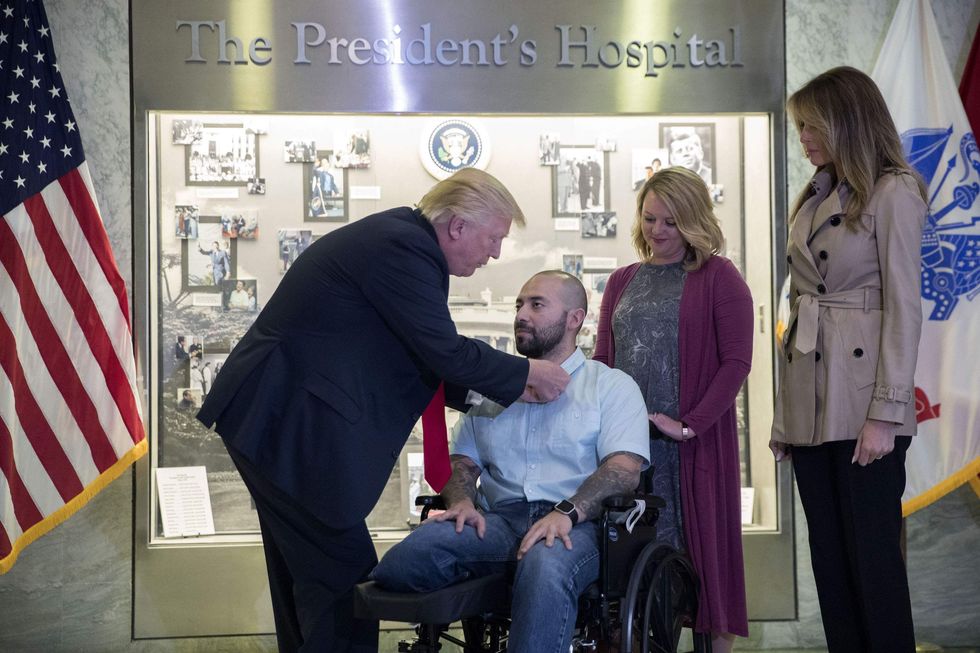 Trump visits Walter Reed military hospital — then gives wounded vet top award in surprise ceremony