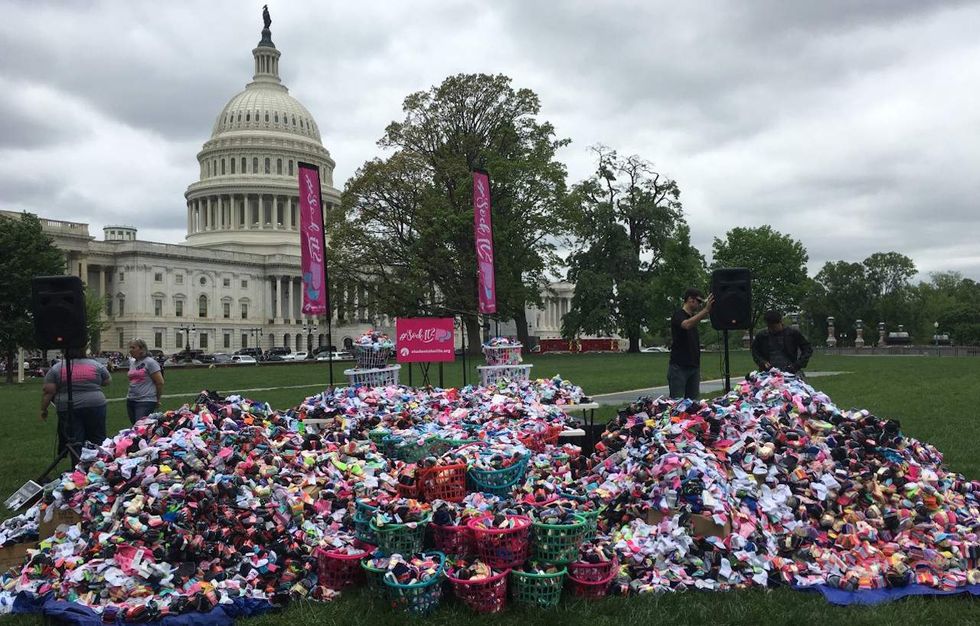 Pro-life group displays 196,543 baby socks at the Capitol to protest Planned Parenthood funding
