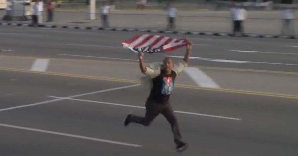 Watch: Brave Cuban man interrupts Havana May Day celebration with US flag — then he pays a price