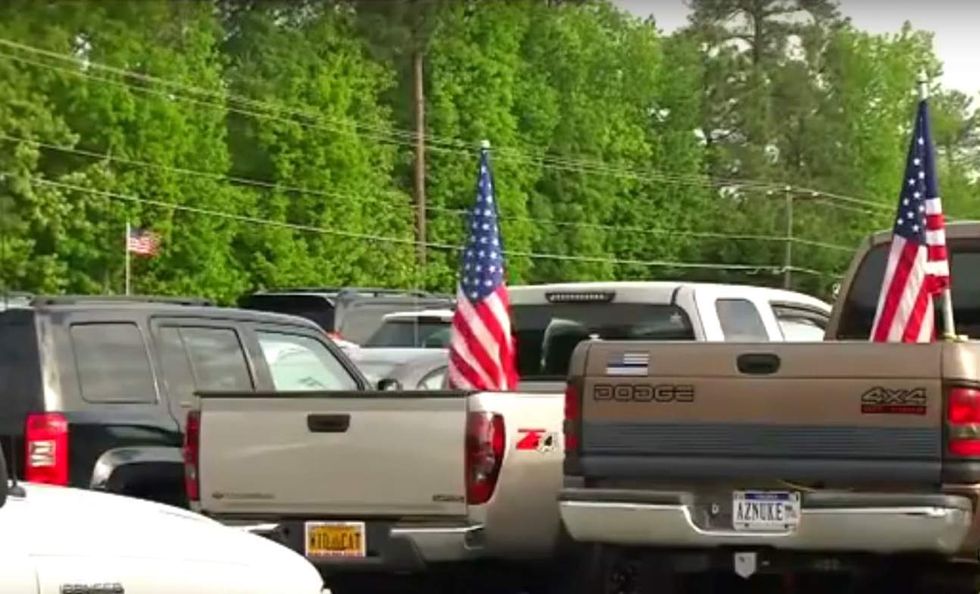 High schoolers hoist US flags to support military—and their principal's reaction might surprise you