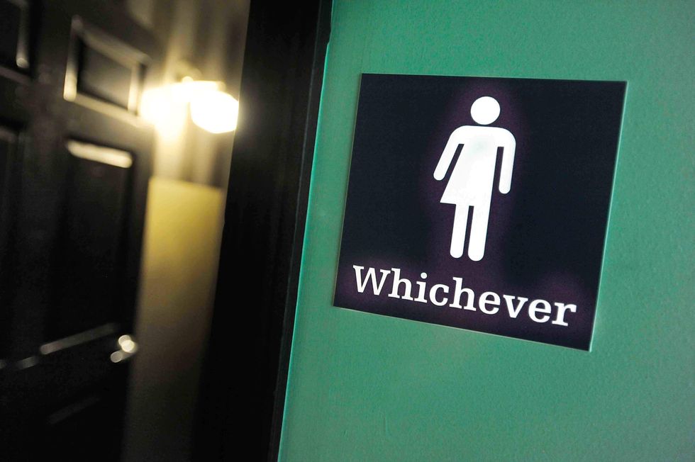 Posters at college restrooms ask students about their 'pee privilege