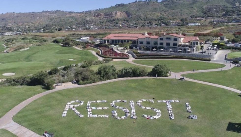 Protesters invade Trump golf club in California to spell 'RESIST' on course with bodies