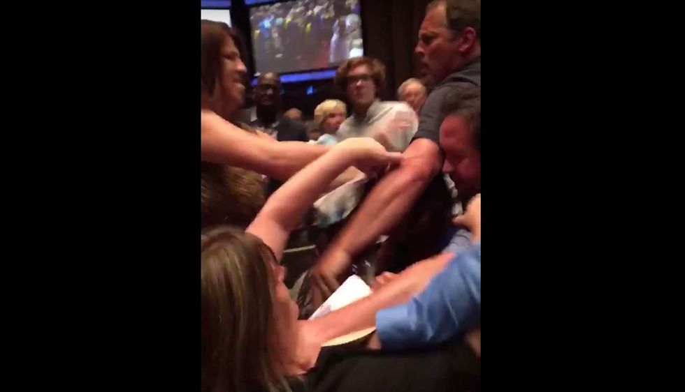 Several adults attending HS graduation caught on video brawling. In a church. Over a seat.