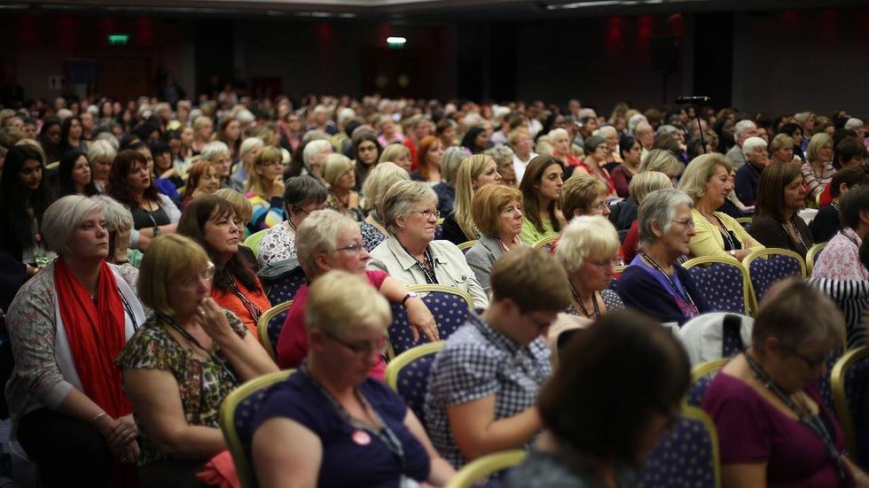 Will Cam dress up as a ‘well-armed woman’ to speak at this conference?