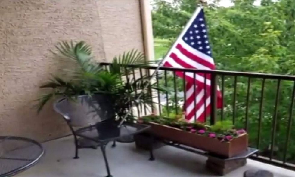 Veteran's daughter ordered to remove 'problem' US flag. But apartment changes tune after news story.