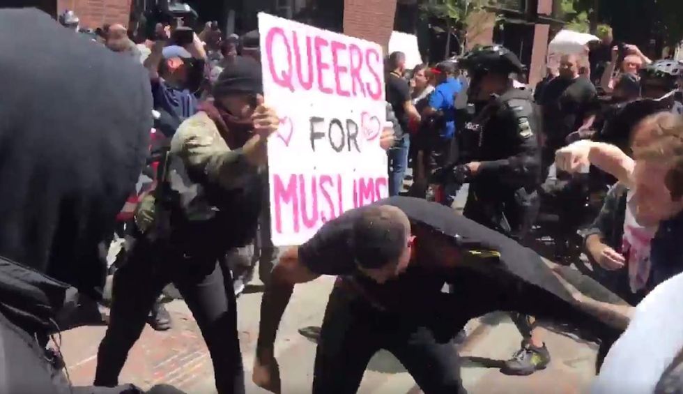 Leftist thugs beat up man at anti-Shariah rally. He's even pummeled with 'Queers for Muslims' sign.