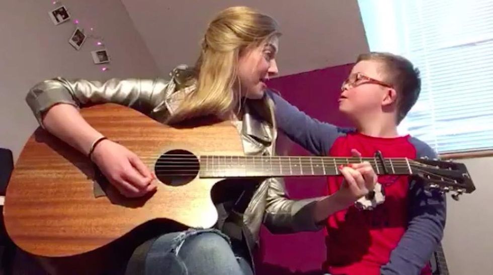 Watch: Sister sings touching song she wrote for brother with Down syndrome in viral video
