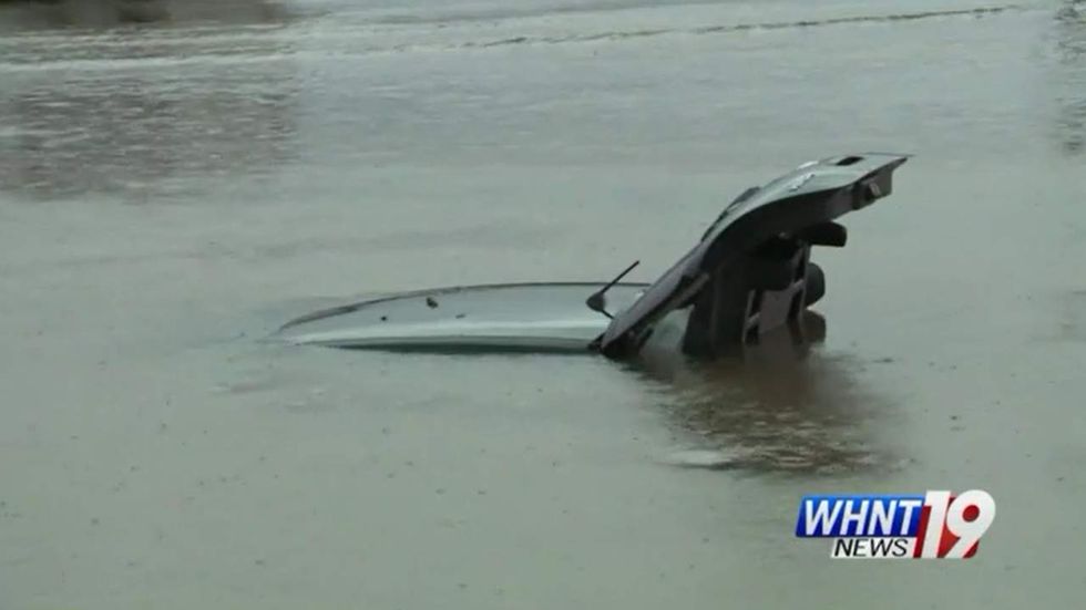 Watch: Alabama woman caught in flash flood heroically saved from Chick-fil-A sinkhole