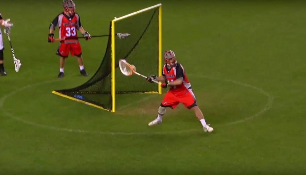 Watch lacrosse goalie score incredible 80-yard shot — and how other goalie helps him out a bit