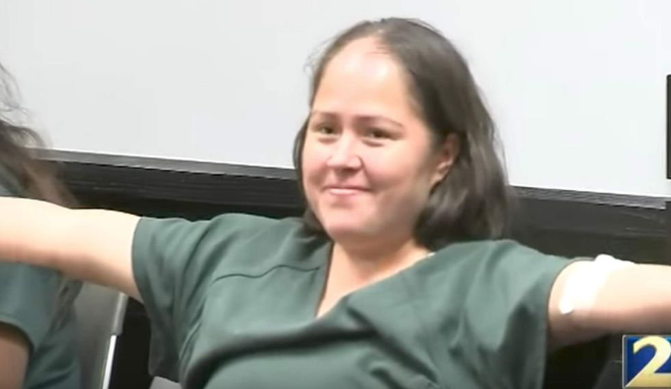 Illegal immigrant accused of slaughtering her family does something bizarre in court