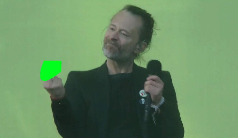 Palestinian flags wave in protest at Radiohead concert. Then singer starts swearing.