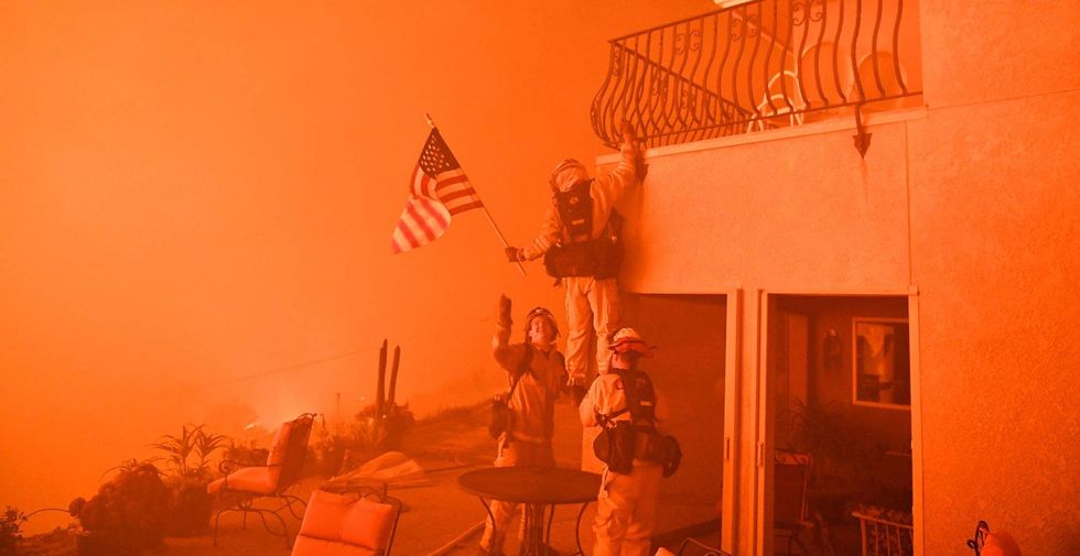 California firefighters rush into flames to save American flag from wildfire