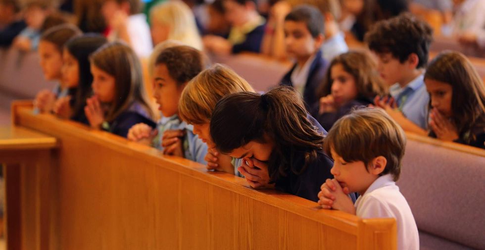 Indiana school district kowtows to atheist group, promises to end graduation prayers