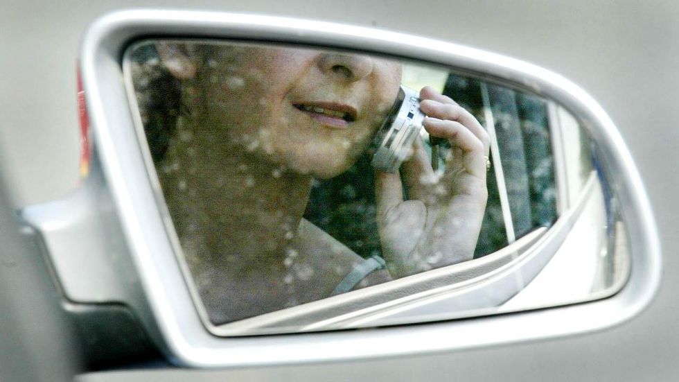 Washington state forbids all handheld phone use while driving