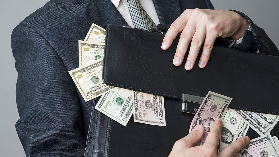 Congressional aides paid millions attempt to flee the US following arrest