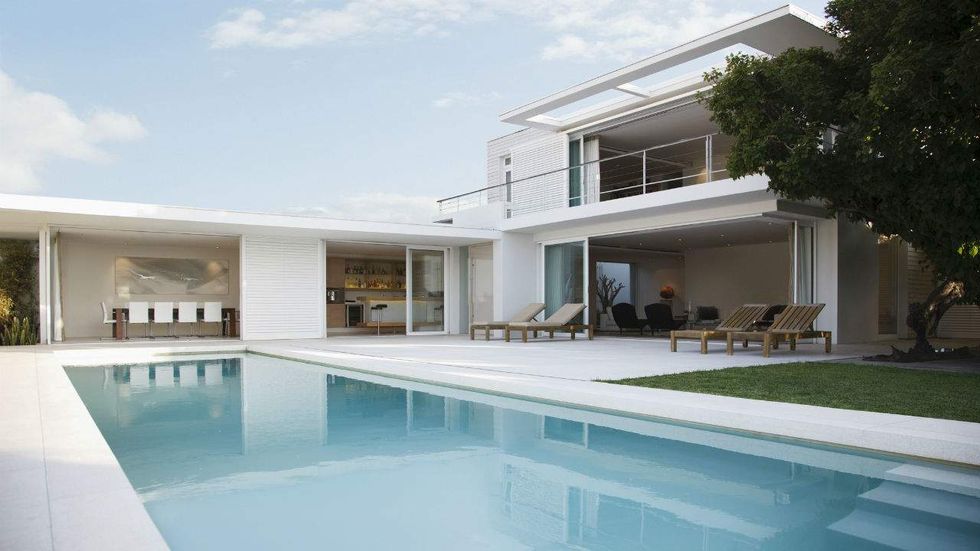This climate warrior's swimming pool uses more energy than six homes use in a year