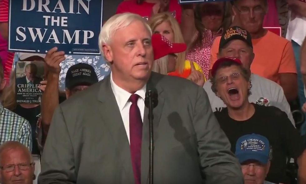 Democratic governor tells boisterous crowd at Trump rally he's switching to Republican Party