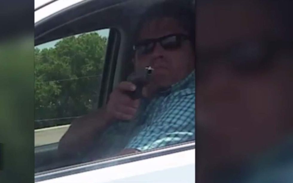 Driver caught on video pointing gun at another motorist tells cops why he did it