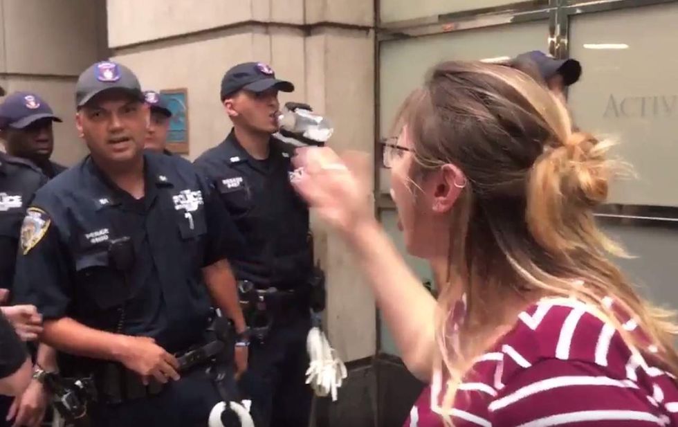 You're f***ing weak!': Enraged leftist goes off on police during protest at Trump Tower