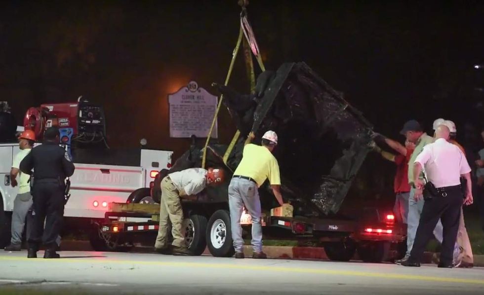 Confederate statues taken down overnight in Baltimore. One opponent of move levels stinging charge.