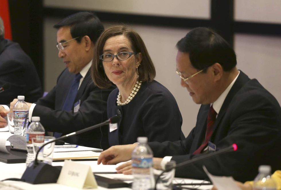 Oregon governor signs bill requiring health insurers to cover abortion