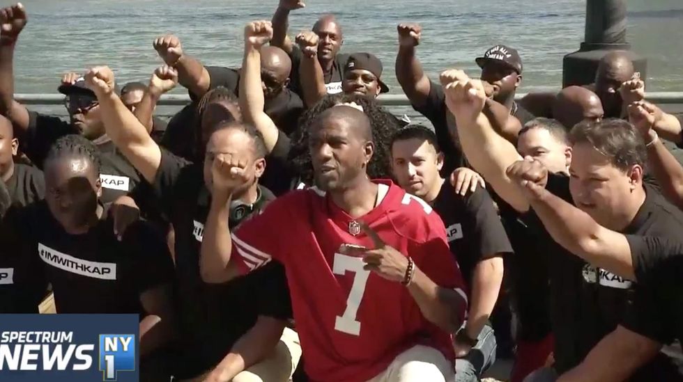 Dozens of NYPD officers rally with raised fists to help Colin Kaepernick secure an NFL contract