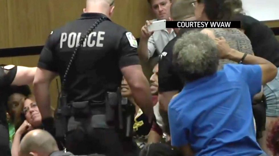 Blood on your hands!' Chaos erupts at Charlottesville council meeting