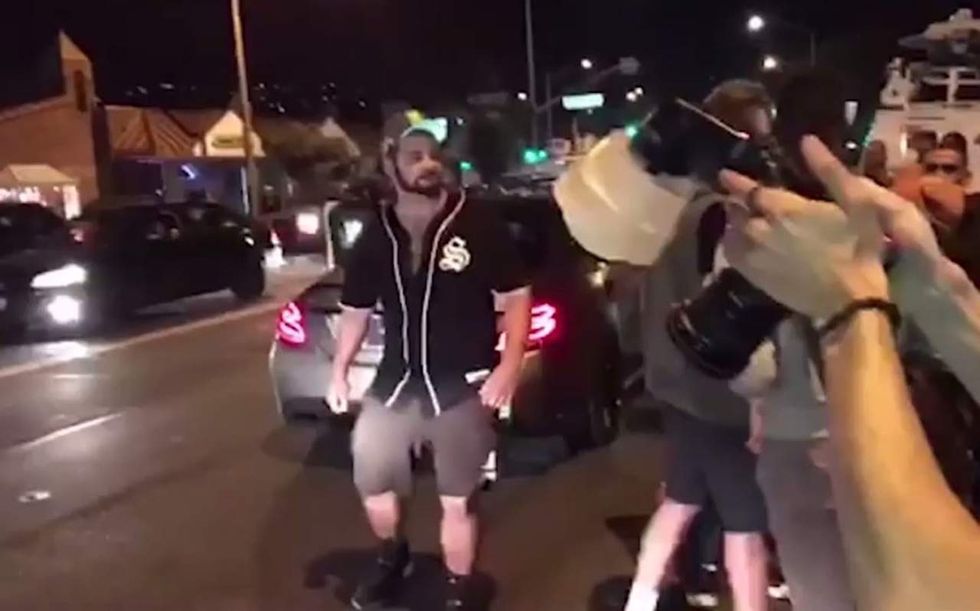 He brags on Twitter that he punched black Trump fan. He dares cops to arrest him. He gets his wish.
