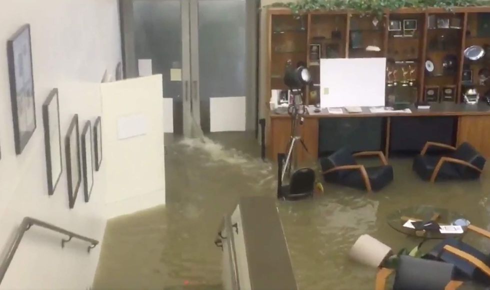 Local Houston news station is live on air when the flood waters come pouring in. Just wow.