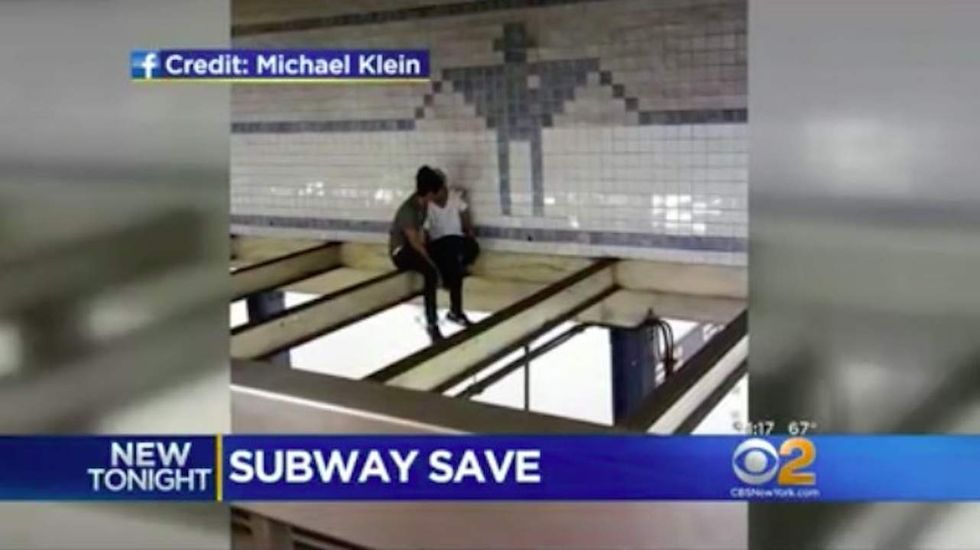 Good Samaritan' climbs beams over NYC subway platform to comfort suicidal woman