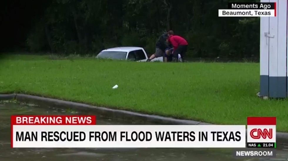 CNN reporter rescues man trapped in floodwaters on live TV