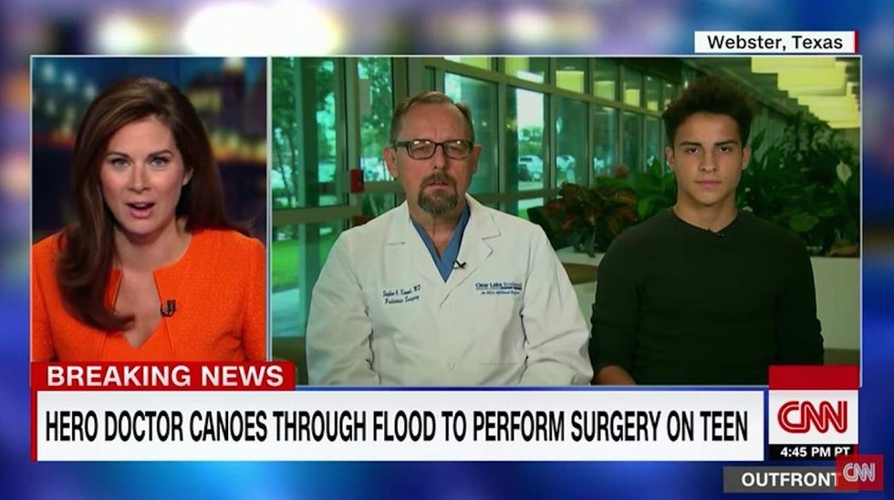 Texas doctor canoes through floodwaters as his own home floods to perform surgery