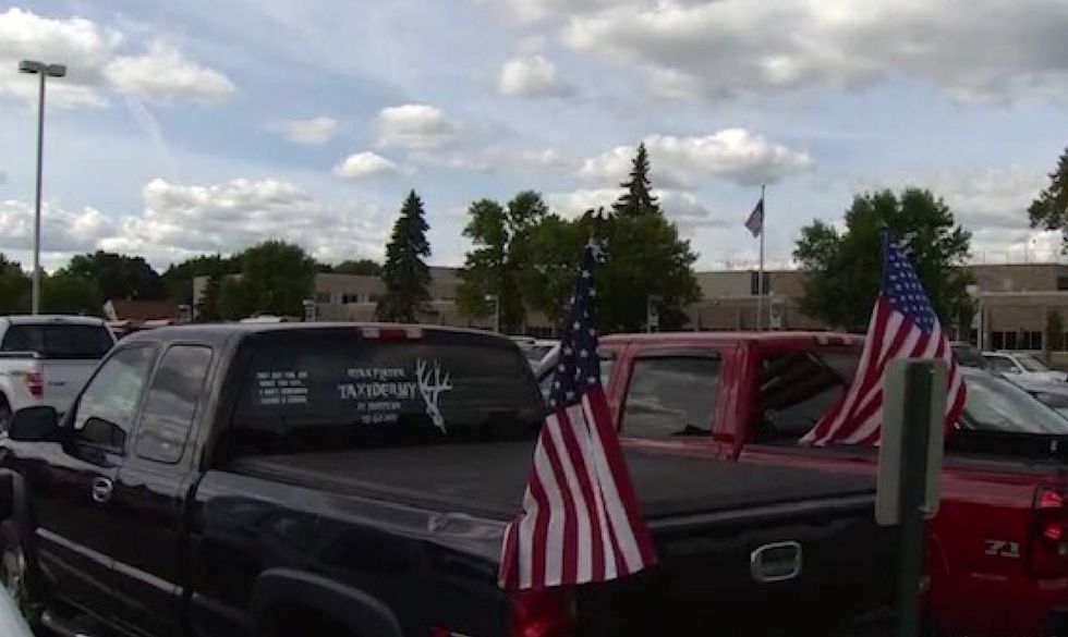 HS bans flags on cars, then students drive in flying Old Glory. The outcome may get you saluting.