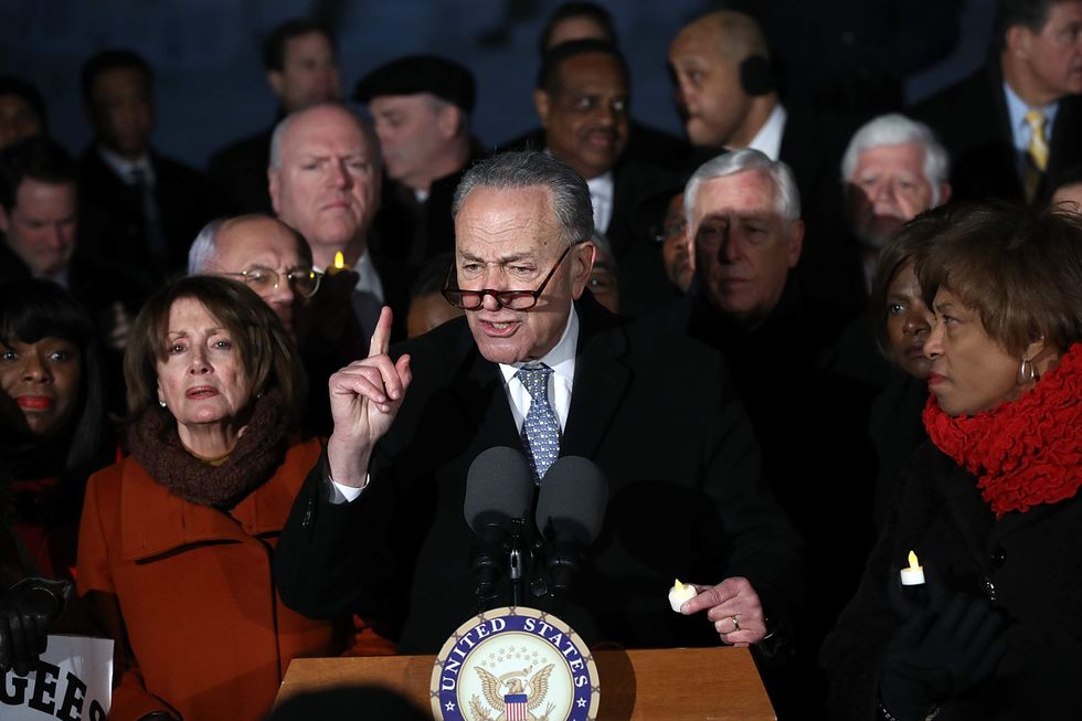 Chuck Schumer was caught on a hot mic talking about Trump. Here's what he said.