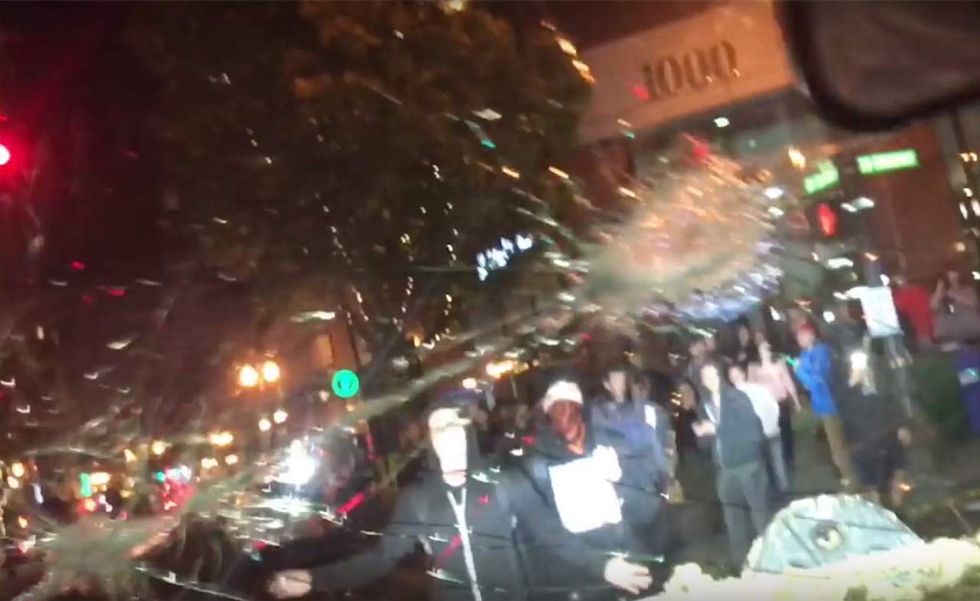 Surrounding protesters start smashing up your car. You fear for your life. What can you legally do?