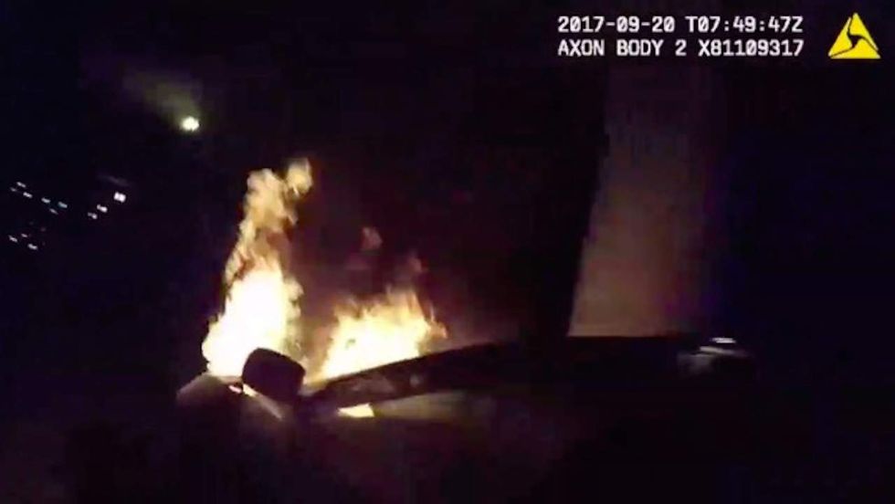 Watch: Atlanta cops save two people from burning car