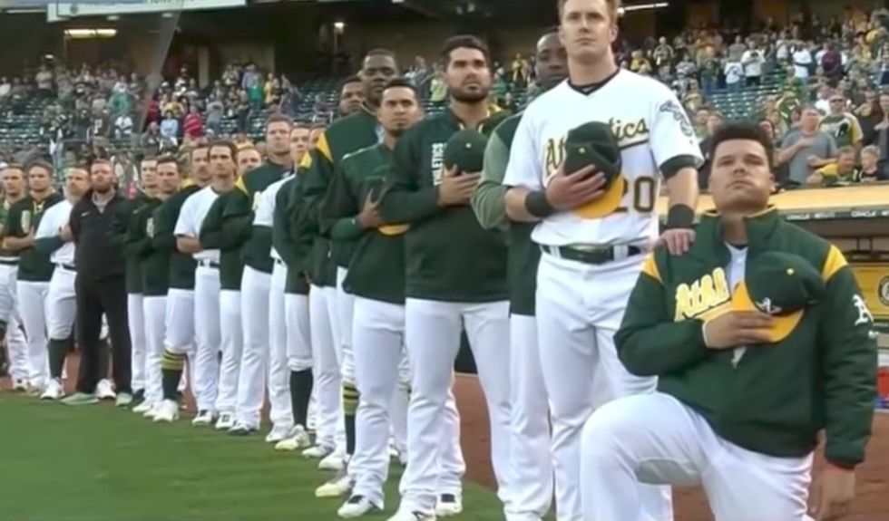 A rookie becomes first to 'take a knee' during an MLB national anthem