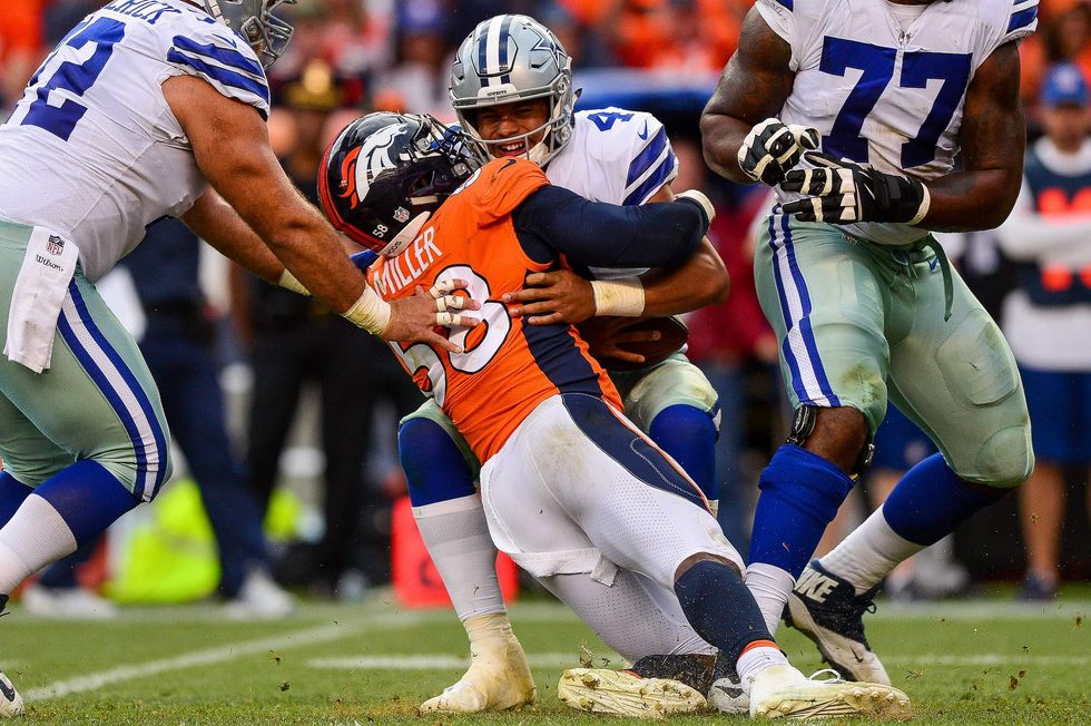 Broncos player takes a knee during national anthem - and loses endorsement over it
