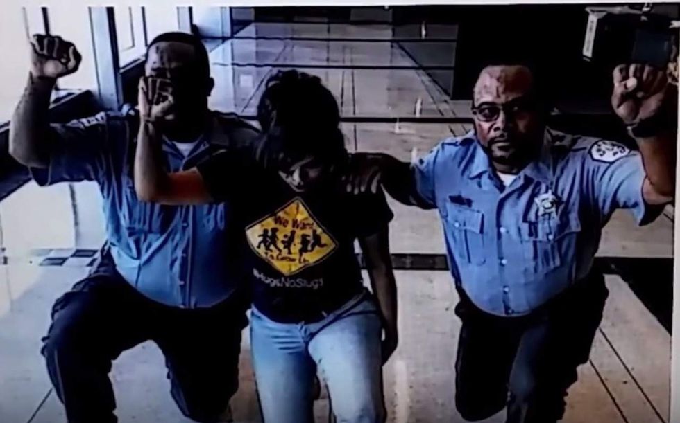 Chicago cops seen taking a knee, raising their fists in photo. Here's how the department responded.
