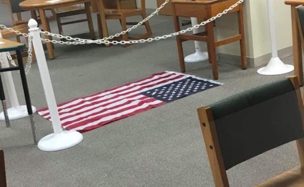 US flag displayed on ground for high school First Amendment forum. Outrage quickly followed.
