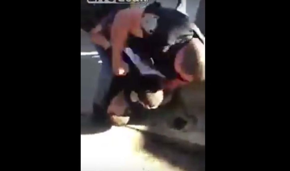 Police say teen pushed cop to ground, put hands on officer's neck. But a fellow cop isn't having it.