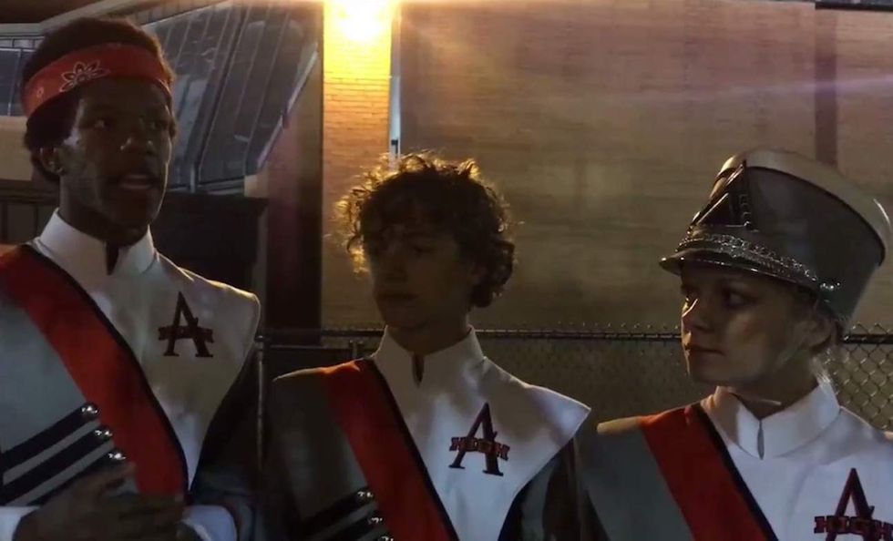 HS marching band members walk off field during national anthem; spectators reportedly curse at them