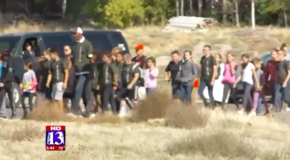 Hundreds of people walk 11-year-old Utah boy home from school after bullies shout racial slurs