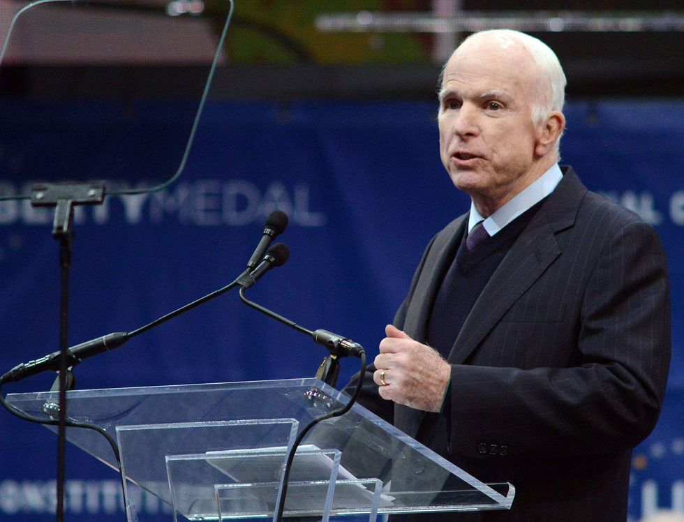 John McCain speaks out against 'half-baked, spurious nationalism' during medal ceremony