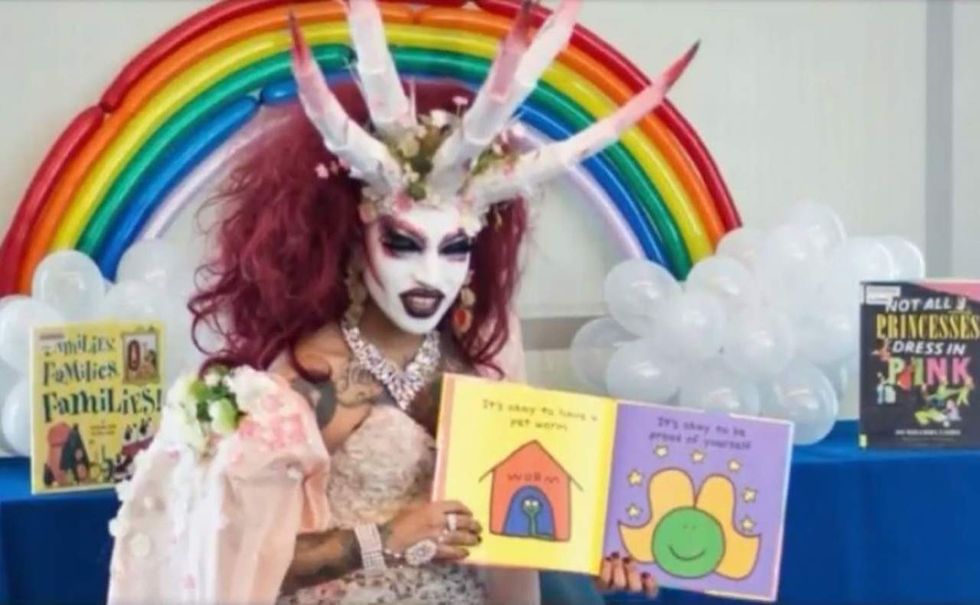 Drag queen with demon-like horns reads to children at Michelle Obama Neighborhood Library