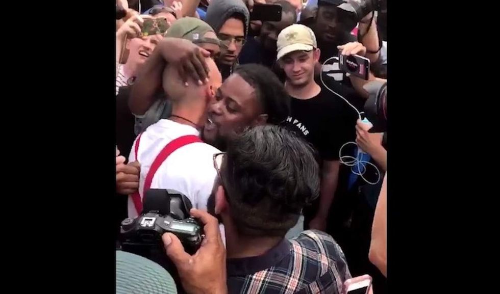 Black man hugs white nationalist in middle of angry mob — and reveals what God whispered in his ear