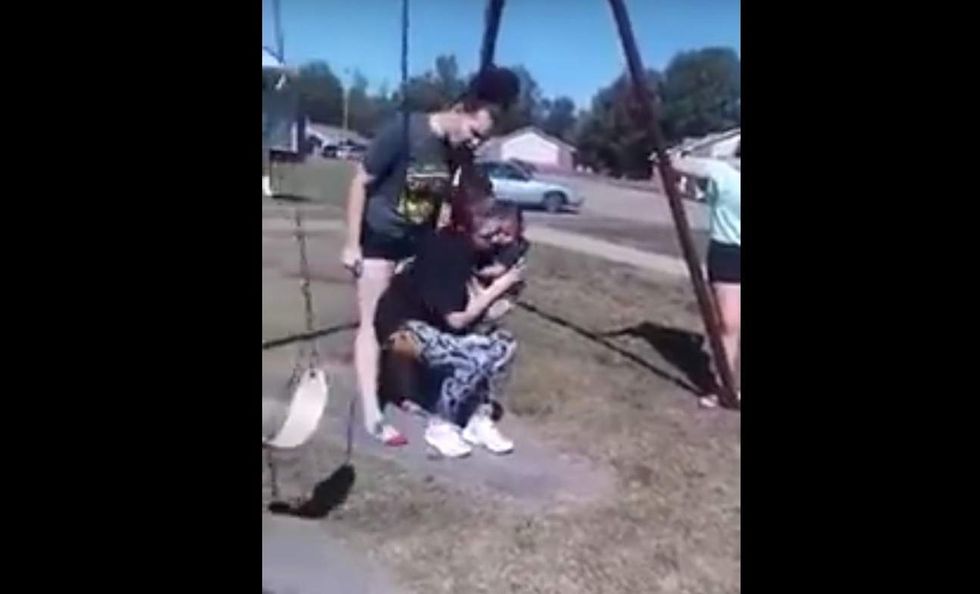 Young mom holding her 6-month-old son attacked by two females on video: 'Somebody get her baby