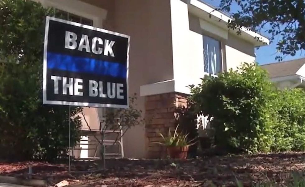 Homeowners post pro-police signs in yards after two cops are murdered. But HOA is having none of it.