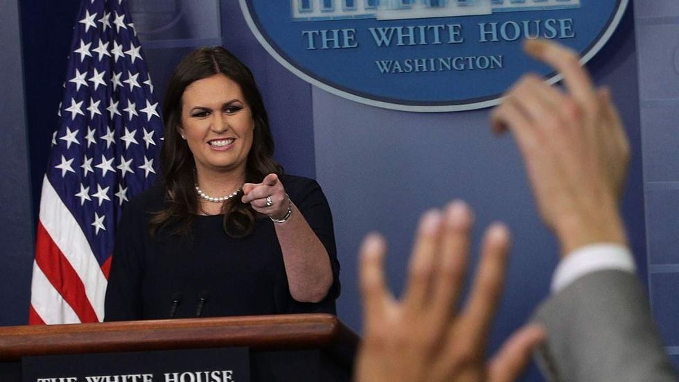 Sarah Sanders holds her ground as Jim Acosta reaches for straws